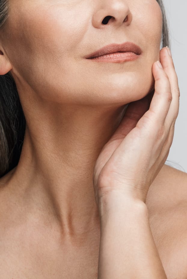 woman touching her face