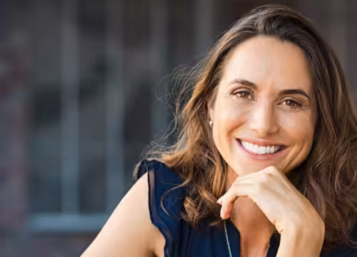 Woman leaning forward and smiling