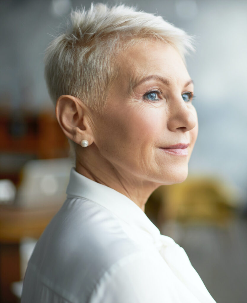 Woman with short hair in a white top